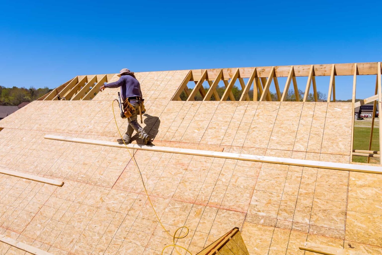 home-roof-construction-applying-roof-plywood-panels-in-new-house.jpg